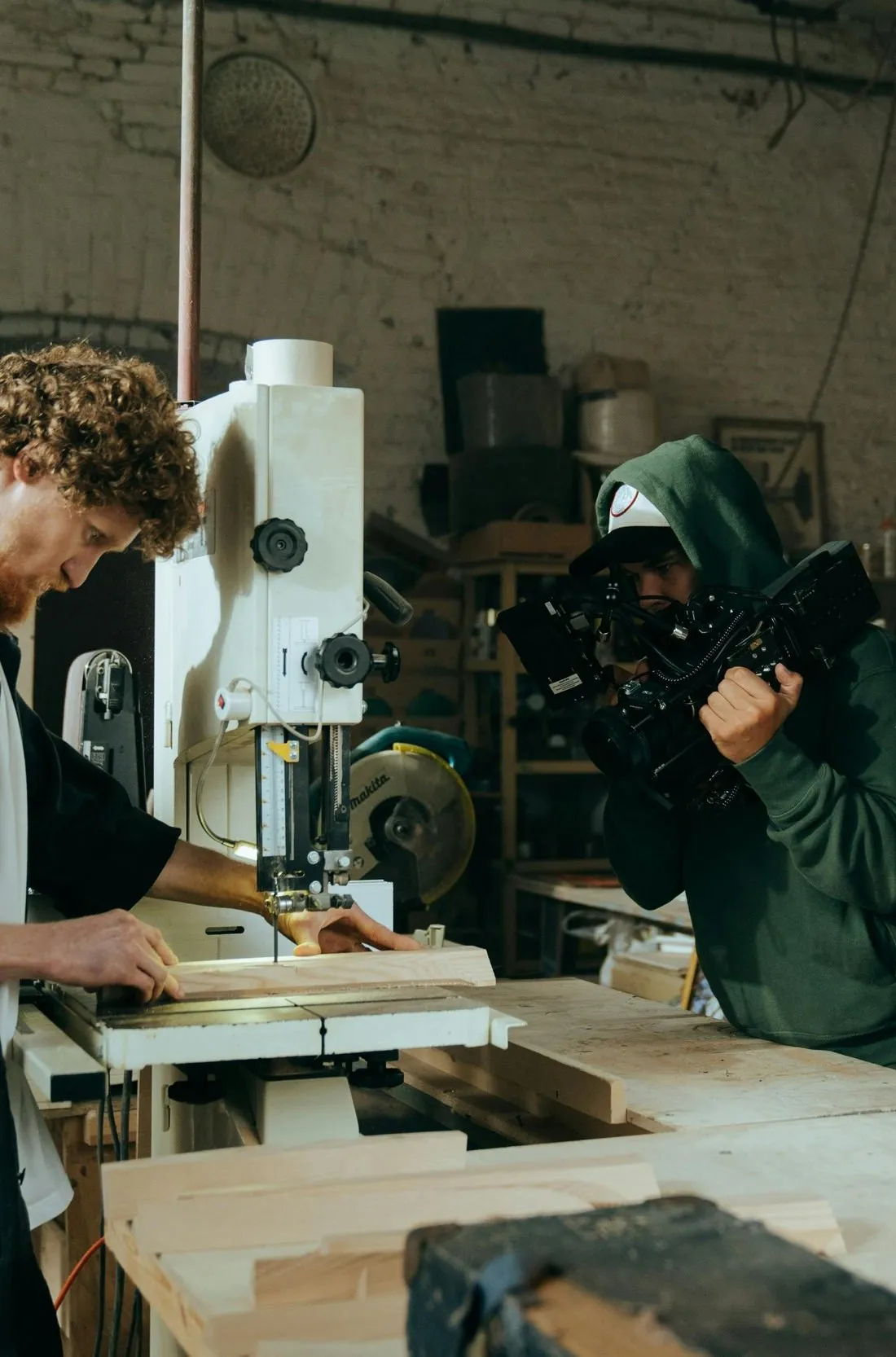 Image Media Lab crew filming a craftsman at his workbench for an internal training video