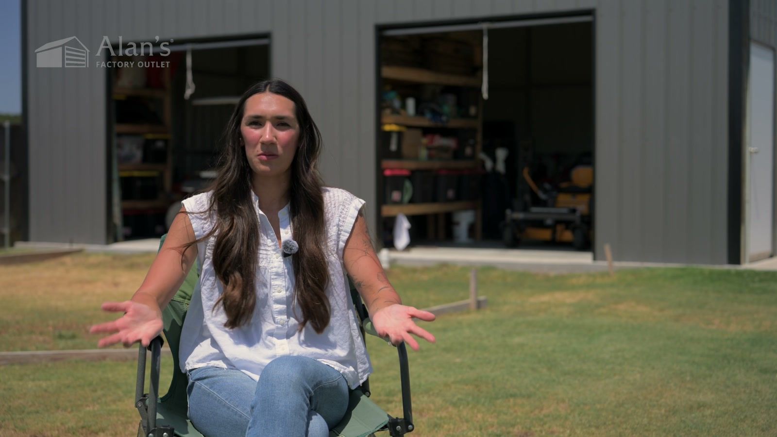 Brittany, an Alan’s Factory Outlet customer, in front of her metal shop